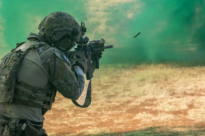 Firing through green smoke during a live-fire exercise